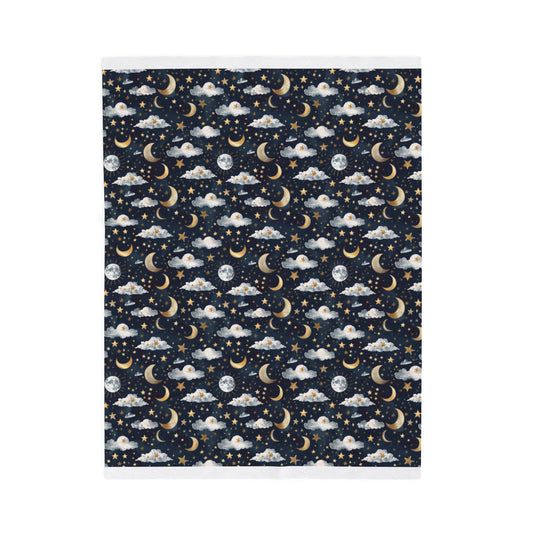 Pattern of moons, stars, and clouds on a dark blue background